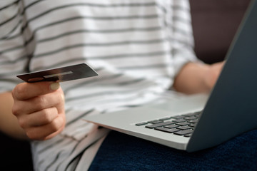 Girl with a credit card makes a purchase