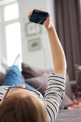 Beautiful young girl talking on the video on the phone