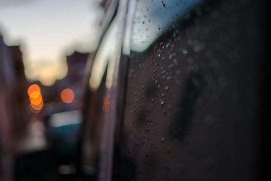 Raindrops On A Black Car On The Side Rear Black Window