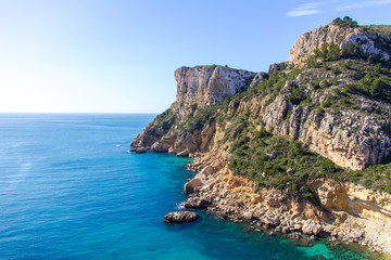 Fototapeta na wymiar Cliffs in Llevant cove beach in Benitatxell, Alicante, Spain