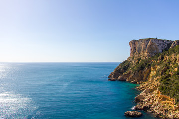 Fototapeta na wymiar Cliffs in Llevant cove beach in Benitatxell, Alicante, Spain