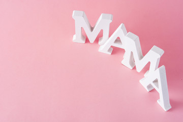 Mama word on pink background. Mother's Day concept. Copyspace
