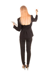 Businesswoman in black suit writing with pen on the screen isolated on white background