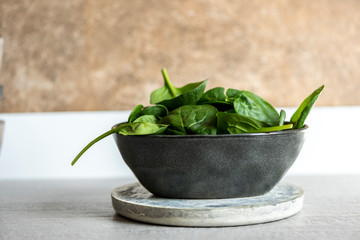 Fresh spinach on a modern crockery bowl on the kitchen
