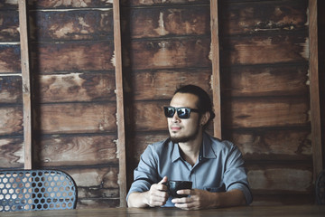 asian man drinking coffee