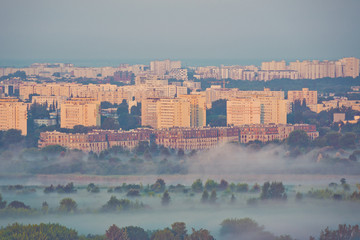 Obraz premium Warsaw foggy city and block of flates with sunrise beautiful colors