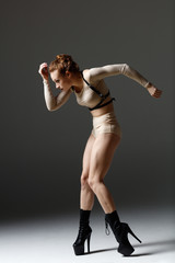 Elegant female dancing striptease dance
