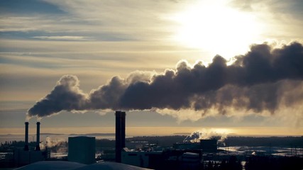 Smoking factory chimneys. Environmental problem of pollution.