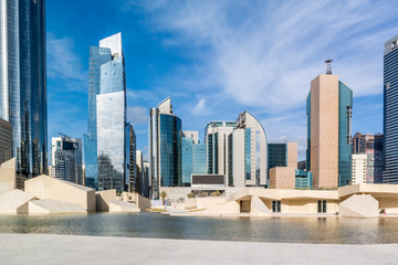 Modern city architecture and famous skyscrapers of Abu Dhabi skyline with beautiful clouds, World...