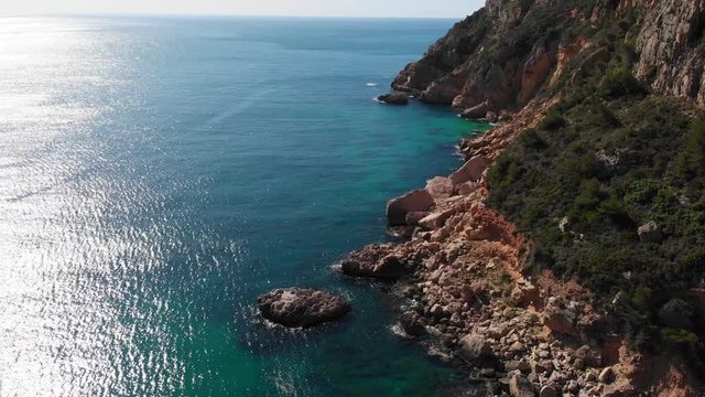 Cliffs in Llevant cove beach in Benitatxell, Alicante, Spain