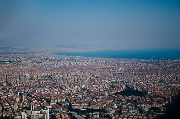 Istanbul city top view from the plane. Houses and mosques and the sea seen from above. Concept of travelling to Turkey. Cityscape