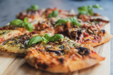 Pizza pieces upcut on a cutting board
