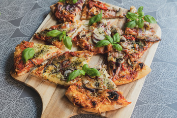 Pizza pieces upcut on a cutting board