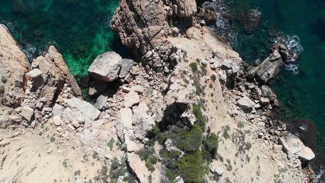 Cliffs in Llevant cove beach in Benitatxell, Alicante, Spain