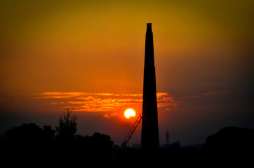 silhouette of tower at sunset