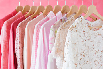 Women's clothes hanging in row on rack