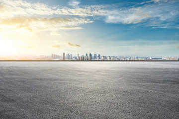 Asphalt race track ground and modern city skyline with buildings in Shanghai