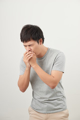 Mature man coughing on white background