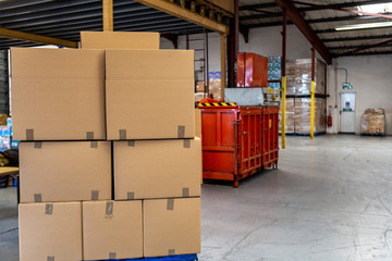 packing and export storage with regal, carton and forklift. industrial warehouse and mini manufactory.cartons for filling with a new commodity.
