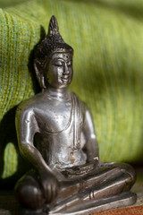 Metal statue of Buddha, close up
