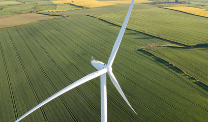 photos of wind turbines providing renewable green energy in england in the country side