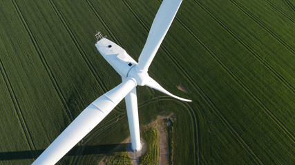 photos of wind turbines providing renewable green energy in england in the country side