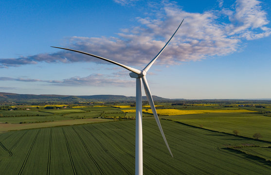 photos of wind turbines providing renewable green energy in england in the country side