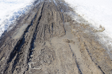Messy dirt road in spring