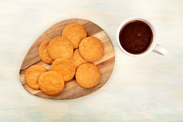 Ginger cookies, shot from the top with a cup of hot chocolate and copy space