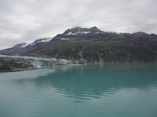 Thin Glacier sliding into Pacifc Ocean providing beautiful view of nature at work