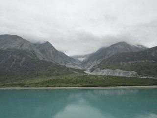 Naklejka na ściany i meble Bleak Snow Covered Mountains along the Inside Passage in Alaska