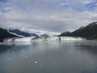 Harvard Glacier College Fjord Alaska Harvard Arm with Snow Covered Mountain Peaks and calm Pacific Ocean with Icebergs from a distance of approx 1 mile