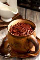 Delicious Cocoa Rice Porridge on the table. Filipino cuisine. Champorado.