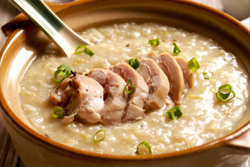 Delicious Chicken Rice Porridge on the table. Filipino cuisine.