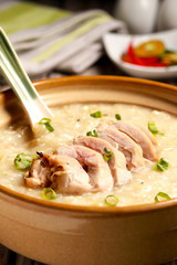 Delicious Chicken Rice Porridge on the table. Filipino cuisine. Arroz caldo.