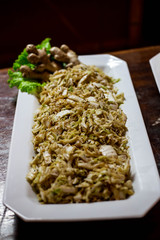 pasta with pesto sauce and fresh basil