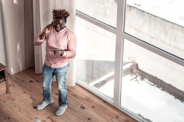 Joyful stylish freelancer having pause after work