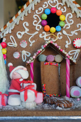 A Christmas gingerbread cookie house decorated for the holidays