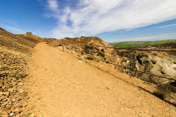 Vista of the lunar-like landscape at the opencast copper mines at Parys Mountain, Amlwch, Anglesey, North Wales