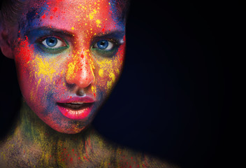 Beauty model with colorful powder make up