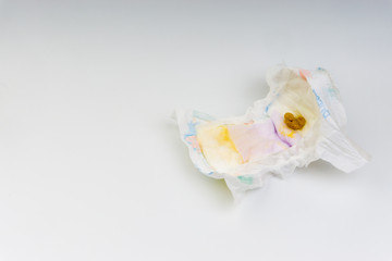 Kuala Lumpur, Malaysia - March 2, 2019 : Yellowish dirty feces of infant on diapers. Selective...