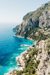 Fototapeta na wymiar Capri coast view. Beautiful island beach with rocks