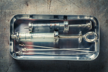 Vintage needle and syringes preparation for vaccination