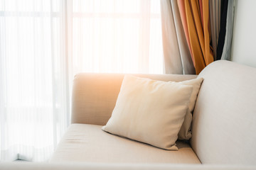 contemporary interior of Living room with part of sofa in sunny day and white curtain interior background concept