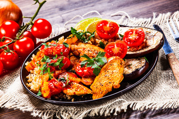 Roasted meat, groats and vegetables