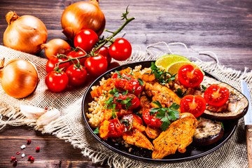 Roasted meat, groats and vegetables