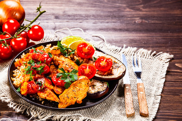 Roasted meat, groats and vegetables