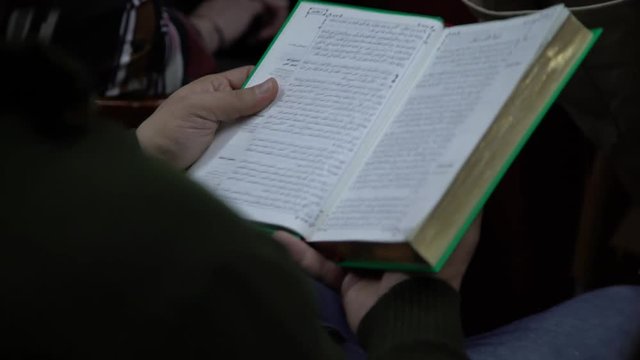 Man looking through an Iraqi Bible