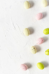 Decorative Easter eggs on white background, space for text. Top view, easter card, banner concept