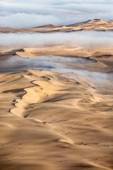 Fog over the sand sea of Sossusvlei, Namibia.